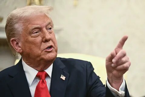 Trump's new meme coin soars on his first day in office, lifts other tokens - Yahoo Finance